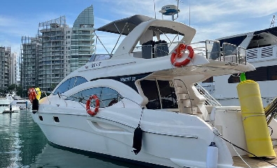 Sleek Flybridge Private Yacht Charter in Singapore with Water Toys